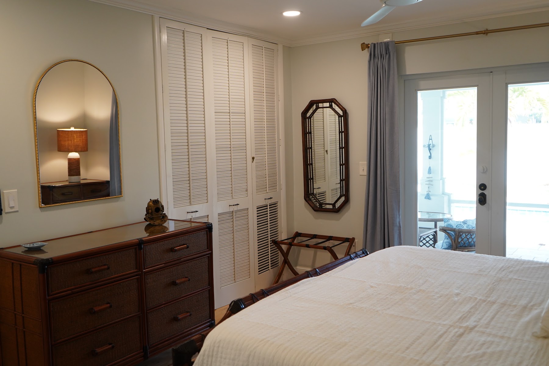 Primary bedroom with dresser and entry